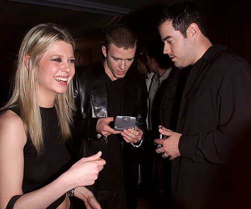 Carson Daly and Justin Timberlake check their cells as Tara Reid laughed in 2001.
Carson Daly and Justin Timberlake check their cells as Tara Reid laughed in 2001.
