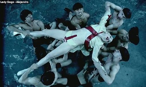 A melodramatic Gaga crowd surfs over her dancers. Note the red arrow pointing to her lady parts.
A melodramatic Gaga crowd surfs over her dancers. Note the red arrow pointing to her lady parts.