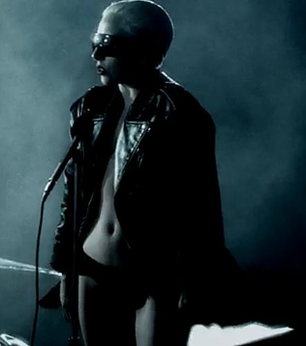 Leather jacket, wraparound sunnies, slicked-back hair — reminds me of the earlier Gaga.
Leather jacket, wraparound sunnies, slicked-back hair — reminds me of the earlier Gaga.