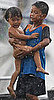 Siblings Carrying Each Other