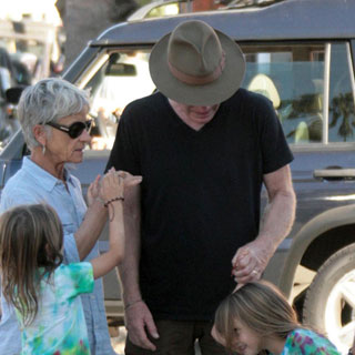 Guess Who's Wearing a Wide-Brimmed Hat?