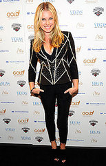 Pictures of Rebecca Romijn Wearing a Piped Jacket