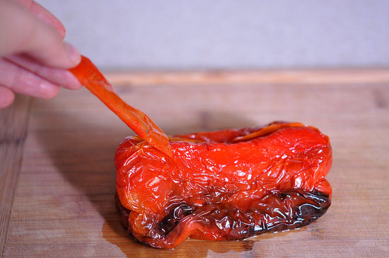 Allow the peppers to cool slightly and peel away any of the skin. It should come off pretty effortlessly.
Allow the peppers to cool slightly and peel away any of the skin. It should come off pretty effortlessly.