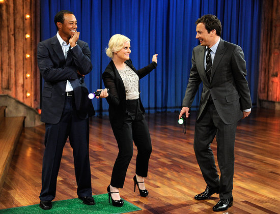 Amy Poehler and Tiger Woods Take a Swing on Late Night With Jimmy Fallon Amy Poehler and Tiger Woods Take a Swing on Late Night With Jimmy Fallon