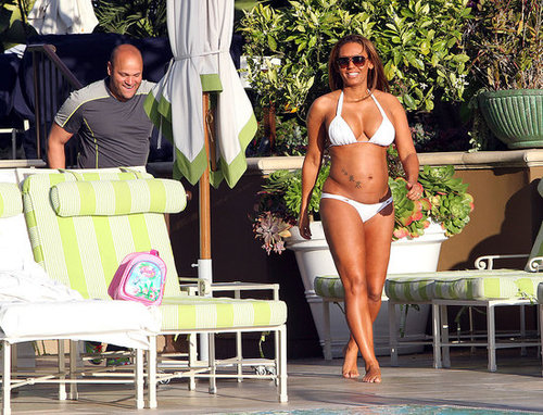 Former Spice Girl Melanie Brown slipped into a white bikini to hang out at the pool with her husband.
Former Spice Girl Melanie Brown slipped into a white bikini to hang out at the pool with her husband.