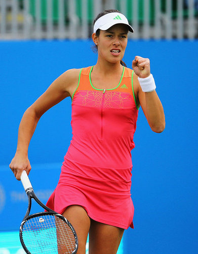 Ana Ivanovic kept up with this seasons neon color trend in a hot pink, orange, and green dress.
Ana Ivanovic kept up with this seasons neon color trend in a hot pink, orange, and green dress.