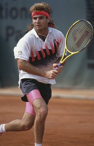 Andre Agassi was in style with a red sweat band tied at the back of his neck to keep his long, flowy locks out of his face. He finally traded in his head piece for . . .
Andre Agassi was in style with a red sweat band tied at the back of his neck to keep his long, flowy locks out of his face. He finally traded in his head piece for . . .