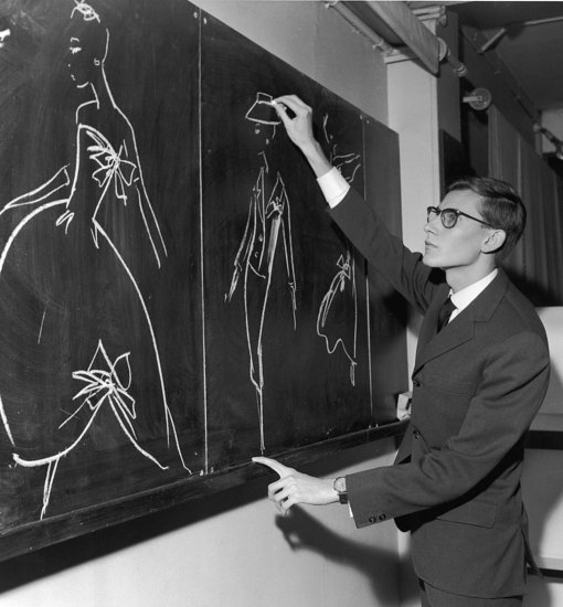Yves Saint Laurent began his career at the House of Dior — here he's shown working on new designs in Paris in 1960.
Yves Saint Laurent began his career at the House of Dior — here he's shown working on new designs in Paris in 1960.