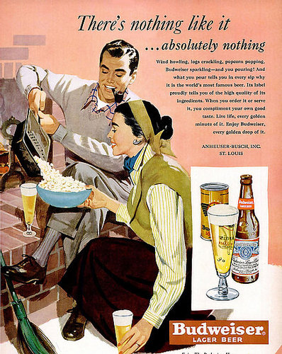 "Wind howling, logs crackling, popcorn popping, Budweiser sparkling," reads the copy of this 1950 ad featuring a young couple. Both the man and the woman are casually enjoying a cool glass of bud on a presumably colder day.
"Wind howling, logs crackling, popcorn popping, Budweiser sparkling," reads the copy of this 1950 ad featuring a young couple. Both the man and the woman are casually enjoying a cool glass of bud on a presumably colder day.