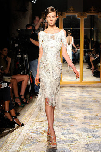 Marchesa's body-conscious silhouettes drew us in with fringed detailing and a hint of skin.
Marchesa's body-conscious silhouettes drew us in with fringed detailing and a hint of skin.