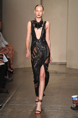 Donna Karan hit a severely sexy note with a neckline down to there on this embellished black evening gown.
Donna Karan hit a severely sexy note with a neckline down to there on this embellished black evening gown.