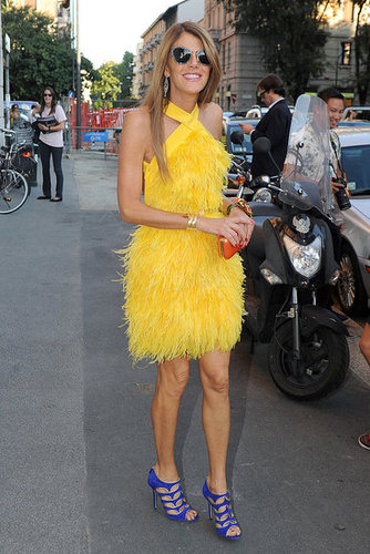 Anna Dello Russo worked in a feathery yellow frock and purple heels.
Anna Dello Russo worked in a feathery yellow frock and purple heels.