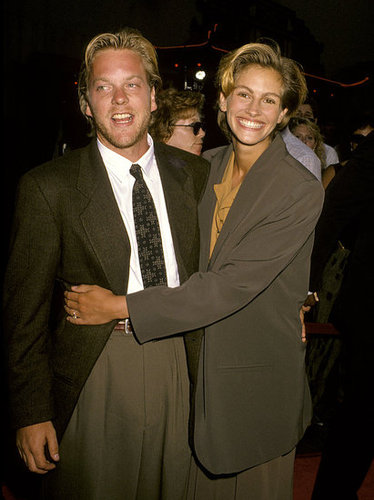 Julia Roberts smiled and snuggled with then-fiancé Kiefer Sutherland at the Young Guns II premiere in 1990.
Julia Roberts smiled and snuggled with then-fiancé Kiefer Sutherland at the Young Guns II premiere in 1990.