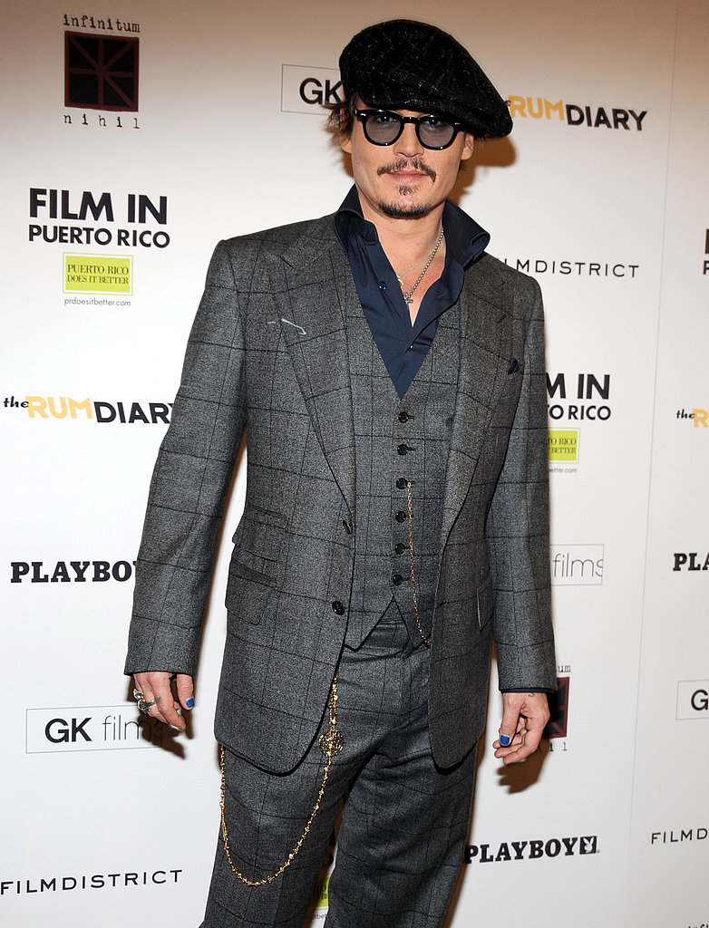 Johnny Depp wore a three-piece suit to the premiere. Johnny Depp wore a three-piece suit to the premiere.