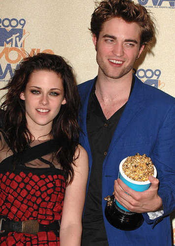 Robert Pattinson and Kristen Stewart pressed against each other in the MTV VMAs press room in May 2009.
Robert Pattinson and Kristen Stewart pressed against each other in the MTV VMAs press room in May 2009.