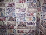 Pesos on the Bathroom Walls