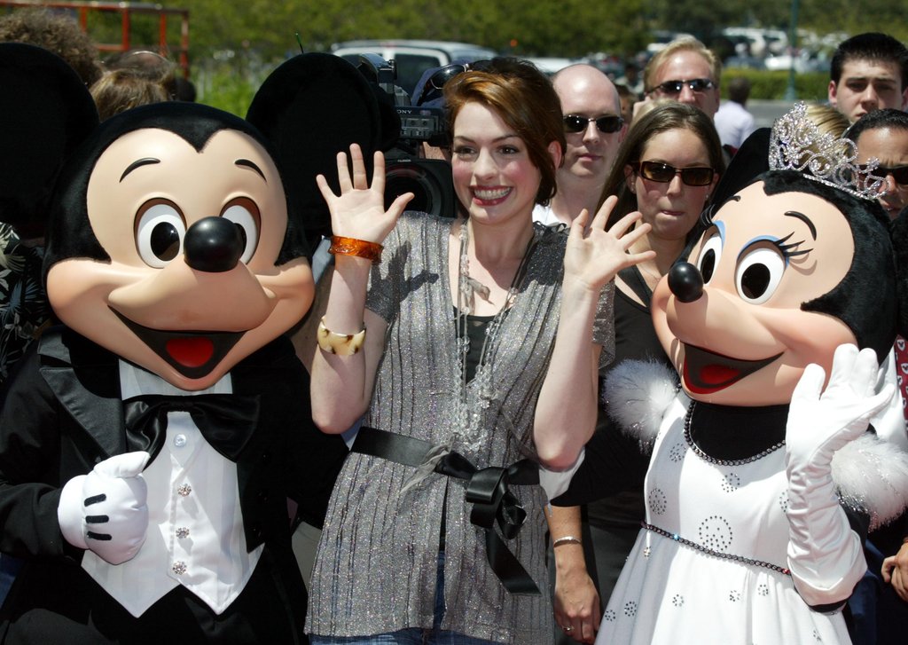 Anne Hathaway got together with Mickey and Minnie in August 2004.
Anne Hathaway got together with Mickey and Minnie in August 2004.