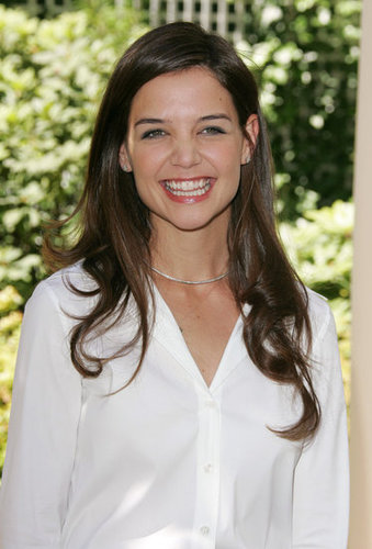 Katie Holmes flashed a big smile at the Batman Begins Paris photocall in June 2005.
Katie Holmes flashed a big smile at the Batman Begins Paris photocall in June 2005.