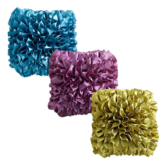 Dramatic ruffles and punchy brights ($23.96) dress up even the simplest of sofas.
Dramatic ruffles and punchy brights ($23.96) dress up even the simplest of sofas.