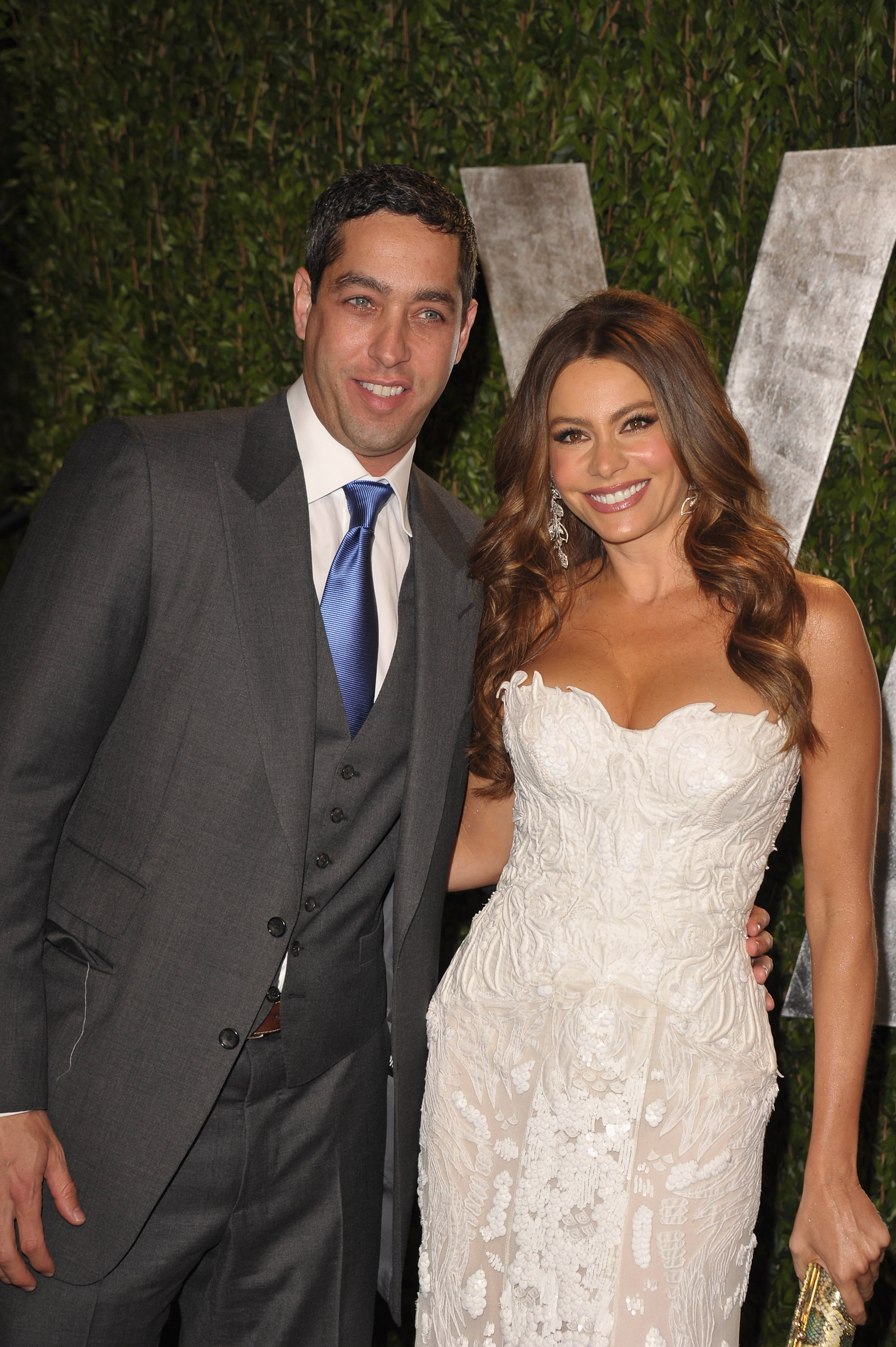 Sofia Vergara in a strapless white lace gown by Roberto Cavalli with boyfriend Nick Loeb. Sofia Vergara in a strapless white lace gown by Roberto Cavalli with boyfriend Nick Loeb.