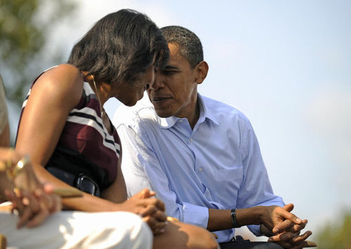 The Obamas put their heads together in Detroit.
The Obamas put their heads together in Detroit.