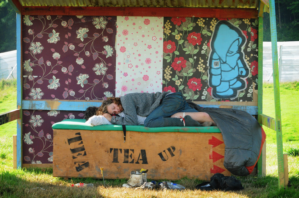 Glastonbury Music Festival goers napped together.
Glastonbury Music Festival goers napped together.