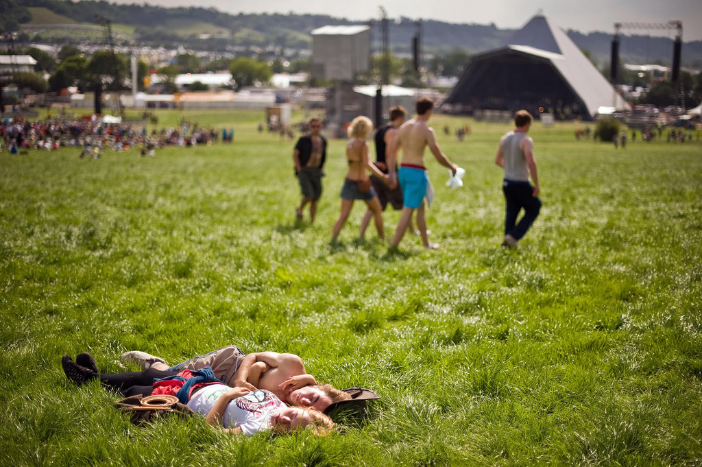 A couple soaked up the sun in the grass at the annual Glastonbury festival in England.
A couple soaked up the sun in the grass at the annual Glastonbury festival in England.