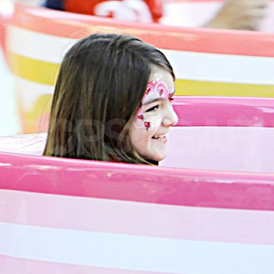 Suri was all smiles as she showed off her fun face paint design at Disneyland with her dad! Suri was all smiles as she showed off her fun face paint design at Disneyland with her dad!