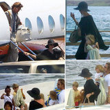 Newly engaged Brad Pitt and Angelina Jolie and their children get off a boat as they vacation in the Galapagos Islands.