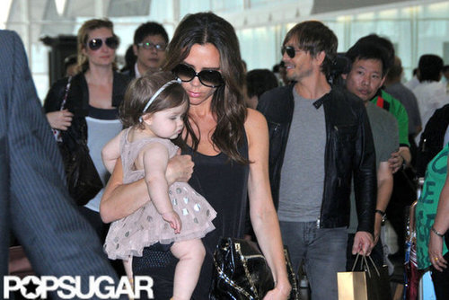 Victoria Beckham carried daughter Harper Beckham at the Hong Kong airport.
Victoria Beckham carried daughter Harper Beckham at the Hong Kong airport.