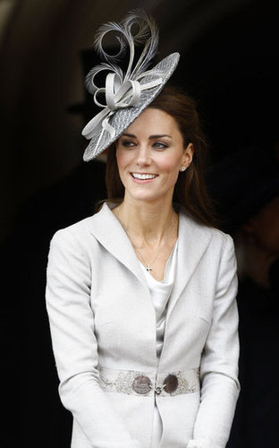 She matched a slick, long gray coat with a fanciful gray fascinator in June 2011.
She matched a slick, long gray coat with a fanciful gray fascinator in June 2011.