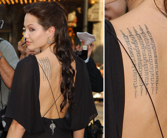 Angelina Jolie's back features Buddhist text. It's reportedly a recitation meant to protect her and son Maddox. It reads, "May your enemies run far away from you. If you acquire riches, may they remain yours always. Your beauty will be that of Apsara. Wherever you may go, many will attend, serve and protect you, surrounding you on all sides."
Angelina Jolie's back features Buddhist text. It's reportedly a recitation meant to protect her and son Maddox. It reads, "May your enemies run far away from you. If you acquire riches, may they remain yours always. Your beauty will be that of Apsara. Wherever you may go, many will attend, serve and protect you, surrounding you on all sides."