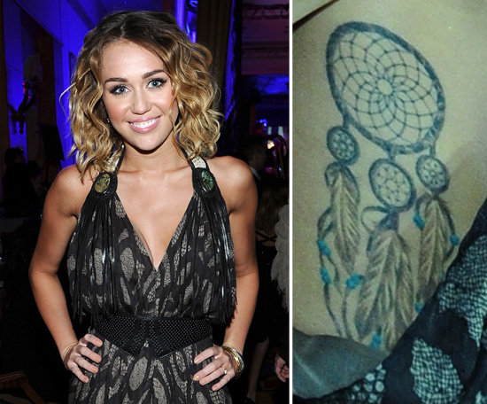 Miley Cyrus has a dream catcher tattoo on her rib cage.
Miley Cyrus has a dream catcher tattoo on her rib cage.