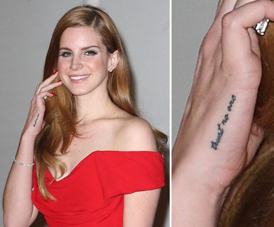 Singer Lana Del Rey has numerous tattoos, and on her right hand the saying, "trust no one" and on her left "paradise."
Singer Lana Del Rey has numerous tattoos, and on her right hand the saying, "trust no one" and on her left "paradise."