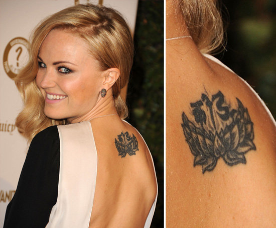 Malin Akerman, raised Buddhist, has a large lotus flower and a Tibetan Sanskrit message which reads "to play" inked on the upper part of her back.
Malin Akerman, raised Buddhist, has a large lotus flower and a Tibetan Sanskrit message which reads "to play" inked on the upper part of her back.