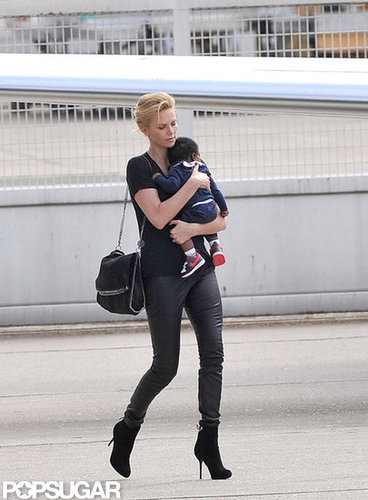 Baby Jackson Theron kept his toes warm in miniature Nike sneakers.
Baby Jackson Theron kept his toes warm in miniature Nike sneakers.