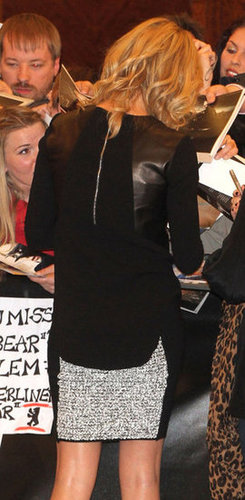 From behind, we got a glimpse of the leather paneling on Charlize's top.
From behind, we got a glimpse of the leather paneling on Charlize's top.