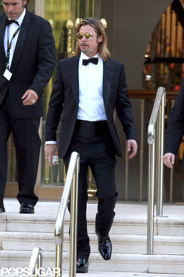 Brad Pitt carried a drink outside the Eden Roc Hotel. Brad Pitt carried a drink outside the Eden Roc Hotel.
