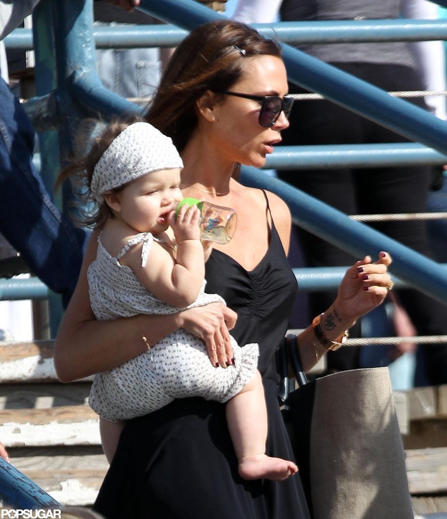 Victoria Beckham carried daughter Harper Beckham. Victoria Beckham carried daughter Harper Beckham.