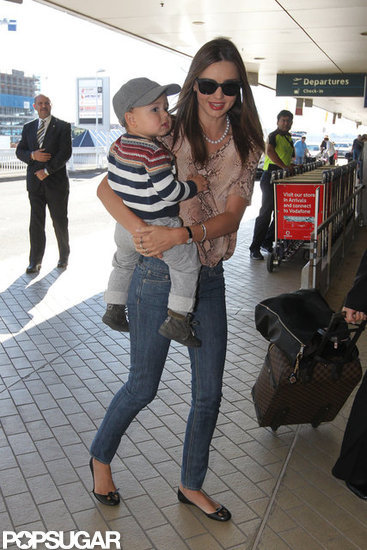 Miranda Kerr carried son, Flynn Bloom, at the Sydney airport. Miranda Kerr carried son, Flynn Bloom, at the Sydney airport.