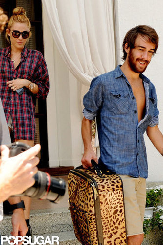 Miley Cyrus left her Miami hotel with friend Cheyne Thomas.
Miley Cyrus left her Miami hotel with friend Cheyne Thomas.