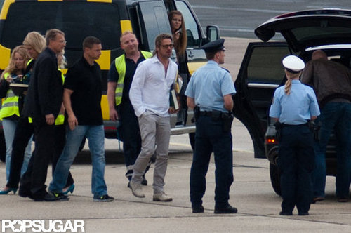 Brad Pitt walked to his waiting plane.
Brad Pitt walked to his waiting plane.