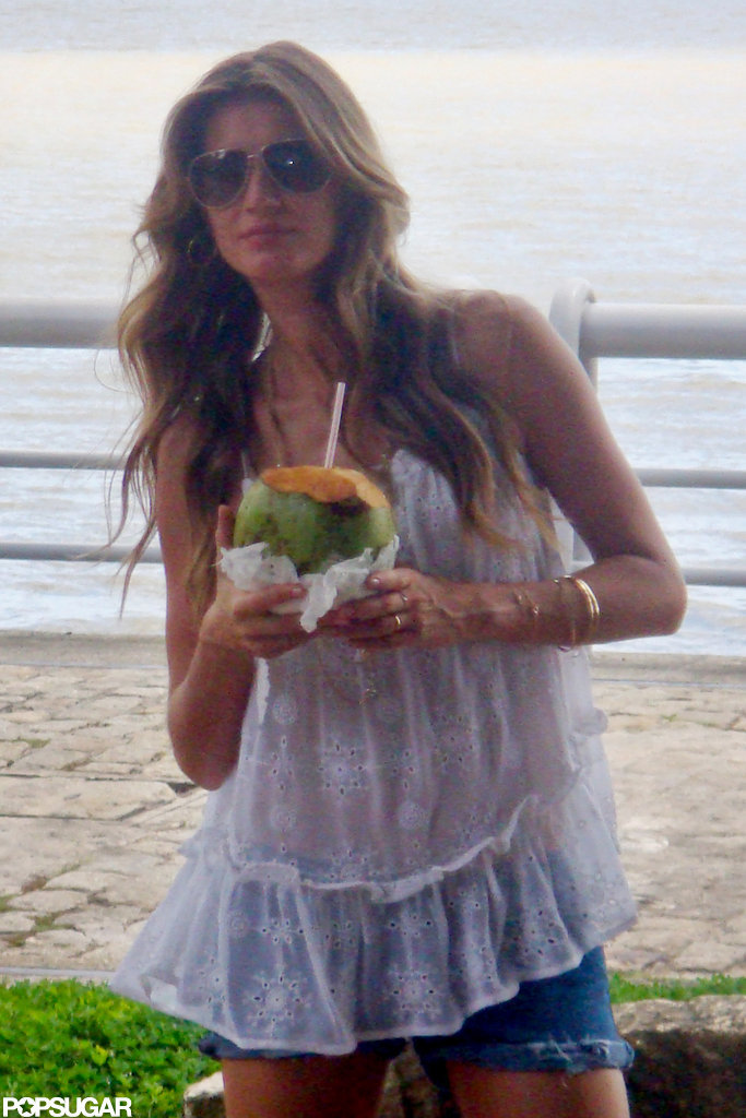 Gisele Bundchen drank coconut water at a photo shoot in Brazil. Gisele Bundchen drank coconut water at a photo shoot in Brazil.