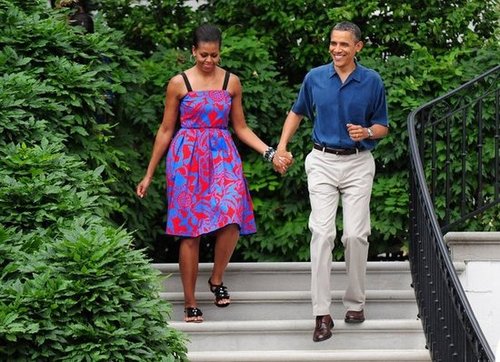 A patriotic Michelle and Barack walked hand in hand in 2011.
A patriotic Michelle and Barack walked hand in hand in 2011.
