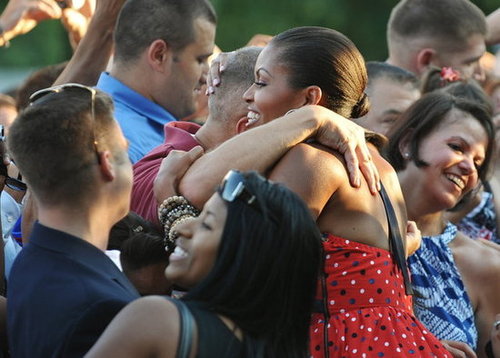 A patriotic Michelle hugged a guest at the 2010 festivities.
A patriotic Michelle hugged a guest at the 2010 festivities.