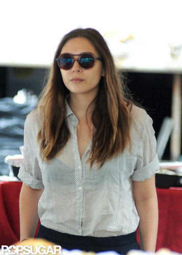Elizabeth Olsen was dressed in a button-down and high-waisted pants on the set of Very Good Girls.
Elizabeth Olsen was dressed in a button-down and high-waisted pants on the set of Very Good Girls.