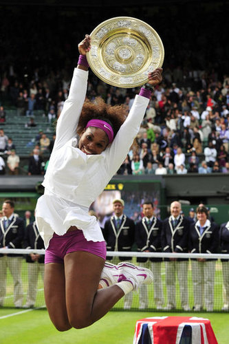 Serena Williams jumped for joy in a cute white and purple tennis ensemble as she celebrated her women's singles final victory at the 2012 Wimbledon championship tournament.
Serena Williams jumped for joy in a cute white and purple tennis ensemble as she celebrated her women's singles final victory at the 2012 Wimbledon championship tournament.