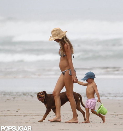 Pregnant Gisele Bundchen hit the beach with Ben and their dog.
Pregnant Gisele Bundchen hit the beach with Ben and their dog.