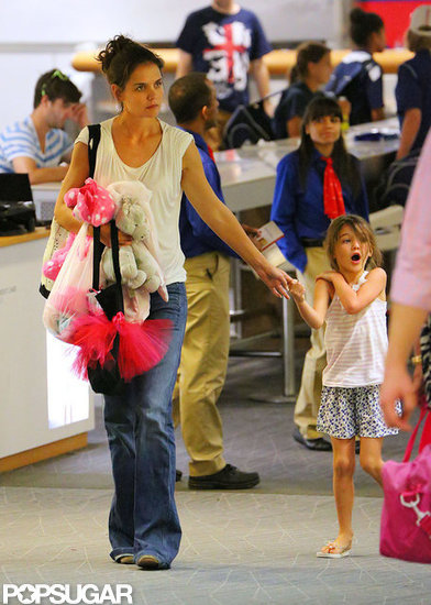 Katie Holmes and Suri Cruise Stick Together For a Commercial Flight Katie Holmes and Suri Cruise Stick Together For a Commercial Flight