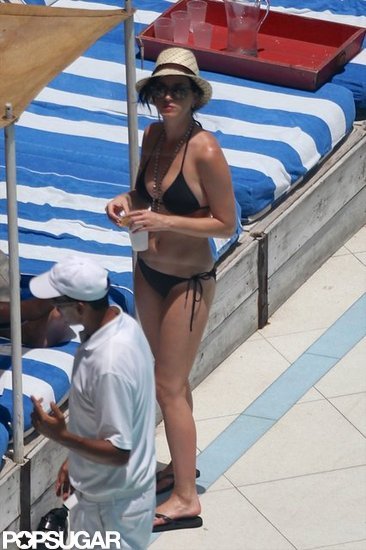 Katy Perry kept her hair covered under a straw fedora.
Katy Perry kept her hair covered under a straw fedora.